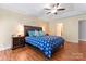 A spacious main bedroom with a trey ceiling, ceiling fan, and an abundance of natural light at 1701 Whitney Ln, Salisbury, NC 28146