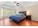 A spacious main bedroom with a trey ceiling, ceiling fan, and an abundance of natural light at 1701 Whitney Ln, Salisbury, NC 28146