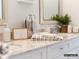 Close-up of a pristine bathroom vanity featuring granite countertops, dual sinks, and decorative accents at 2008 Thatcher Way, Fort Mill, SC 29715