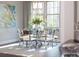 Bright and airy dining room with modern chandelier and seating for six near large windows at 2008 Thatcher Way, Fort Mill, SC 29715