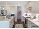 Well-lit eat-in kitchen featuring light gray cabinets, stainless steel appliances, hardwood floors, and white countertops at 2008 Thatcher Way, Fort Mill, SC 29715