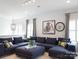 Spacious living room features a large sectional sofa, modern lighting, and stylish decor with bike art at 2008 Thatcher Way, Fort Mill, SC 29715