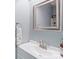 Modern bathroom with white vanity, sink, and a framed mirror at 2012 Killarney Pl, Charlotte, NC 28262
