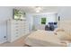 Comfortable bedroom with large dresser, perfect for rest, relaxation, and storing personal belongings at 2012 Killarney Pl, Charlotte, NC 28262