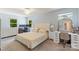Spacious bedroom with a neutral color scheme, a ceiling fan, and lots of natural light at 2012 Killarney Pl, Charlotte, NC 28262