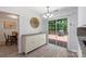 Dining area featuring a decorative cabinet, sliding glass doors to the outdoor deck, and modern lighting at 2012 Killarney Pl, Charlotte, NC 28262