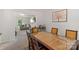 Open dining room with access to living room, featuring a unique table and chairs at 2012 Killarney Pl, Charlotte, NC 28262