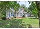 Inviting two-story home features a well-kept lawn, classic blue shutters, and an attached two-car garage at 2012 Killarney Pl, Charlotte, NC 28262