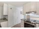 Bright kitchen with white cabinets, granite countertops, and stainless steel oven range at 2012 Killarney Pl, Charlotte, NC 28262
