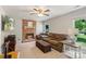 Comfortable living room features a brick fireplace, plush seating, and ample natural light at 2012 Killarney Pl, Charlotte, NC 28262
