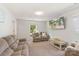 Inviting living room features neutral carpet, comfortable seating, and a large window for ample light at 2012 Killarney Pl, Charlotte, NC 28262