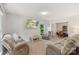 Spacious living room with a view of dining area features neutral walls and plush furniture at 2012 Killarney Pl, Charlotte, NC 28262