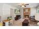 Cozy living room features a charming brick fireplace, plush seating, and a bright window at 2012 Killarney Pl, Charlotte, NC 28262