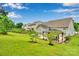 Spacious backyard featuring a gazebo, a patio area, a lush lawn, and a garden, perfect for outdoor living at 2026 Rosewater Ln, Indian Trail, NC 28079