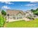 Expansive backyard with well-maintained lawn, patio area, gazebo, and a sports area for fun and relaxation at 2026 Rosewater Ln, Indian Trail, NC 28079