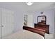 This bedroom features a large dresser with a mirror, closet, and doorway leading to the staircase at 2026 Rosewater Ln, Indian Trail, NC 28079