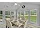 Bright dining room with natural light, white marble table and seating for six at 2026 Rosewater Ln, Indian Trail, NC 28079
