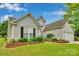 Well-maintained home with green lawn, beautiful flower beds, and lush landscaping, providing a serene setting at 2026 Rosewater Ln, Indian Trail, NC 28079