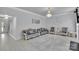 Elegant living room with crystal chandelier, stylish sofas and chairs on a gray ornate rug at 2026 Rosewater Ln, Indian Trail, NC 28079
