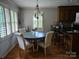 Elegant dining area features a chandelier, hardwood floors and natural light at 217 Rock Creek Dr, Lincolnton, NC 28092