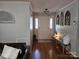 Bright foyer with beautiful hardwood floors and charming decorative accents and entryway seating at 217 Rock Creek Dr, Lincolnton, NC 28092