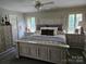 Cozy main bedroom featuring stylish furniture, neutral colors, and natural light from windows at 217 Rock Creek Dr, Lincolnton, NC 28092
