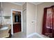 Bathroom view with a granite-look vanity, tiled flooring, a window, and a doorway to a bedroom at 220 Singing Pine Dr, Clover, SC 29710