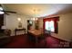 Cozy dining room with a wood dining table, chandelier, and access to other rooms at 220 Singing Pine Dr, Clover, SC 29710