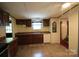 Traditional eat-in kitchen featuring wooden cabinets and a double stainless steel sink at 220 Singing Pine Dr, Clover, SC 29710