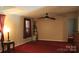 Neutral living room showcasing carpeted floors, a ceiling fan, and ample natural light at 220 Singing Pine Dr, Clover, SC 29710