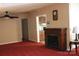 Neutral living room with carpeted floors, electric fireplace and ceiling fan at 220 Singing Pine Dr, Clover, SC 29710