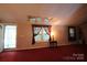 Bright living room featuring a skylight and a door to screened porch at 220 Singing Pine Dr, Clover, SC 29710