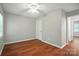 Bedroom with wood floors, ceiling fan, and lots of natural light at 2239 Blue Hampton Ln, Charlotte, NC 28213