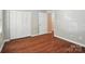 Bedroom featuring closet space, flooring, and wall trim at 2239 Blue Hampton Ln, Charlotte, NC 28213