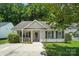 Charming single-story home features light siding, a well-manicured lawn, and a welcoming entrance at 2239 Blue Hampton Ln, Charlotte, NC 28213
