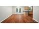 Open kitchen area with hardwood floors, natural wood cabinets, and French doors at 2239 Blue Hampton Ln, Charlotte, NC 28213