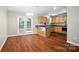 Open kitchen with hardwood floors, wood cabinets, and lots of natural light from French doors at 2239 Blue Hampton Ln, Charlotte, NC 28213