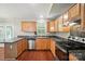Kitchen featuring stainless steel appliances, stone counters, and wood cabinets at 2239 Blue Hampton Ln, Charlotte, NC 28213