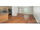Open-concept living room with hardwood floors and natural light at 2239 Blue Hampton Ln, Charlotte, NC 28213