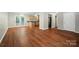 Open living space featuring hardwood floors, neutral walls, and a modern kitchen at 2239 Blue Hampton Ln, Charlotte, NC 28213