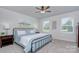 Comfortable bedroom featuring natural light, a ceiling fan and neutral colored walls at 240 Orson Oaks Ln, Pineville, NC 28134