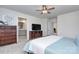 Primary bedroom showcases two dressers, television and an en suite bathroom at 240 Orson Oaks Ln, Pineville, NC 28134