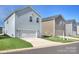 Well-maintained two-story home with an attached one car garage and a neatly manicured lawn at 240 Orson Oaks Ln, Pineville, NC 28134