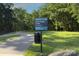 Paved greenway trail with a sign for Little Sugar Creek Greenway and Lake Park address at 240 Orson Oaks Ln, Pineville, NC 28134