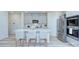 Modern kitchen with stainless steel appliances, island seating, and ample cabinet space at 240 Orson Oaks Ln, Pineville, NC 28134
