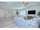Open-concept living room connected to the kitchen and dining area, perfect for entertaining at 240 Orson Oaks Ln, Pineville, NC 28134