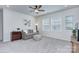Cozy living room features a ceiling fan and neutral decor at 240 Orson Oaks Ln, Pineville, NC 28134