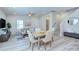 Open-concept floor plan with living, dining, and staircase at 240 Orson Oaks Ln, Pineville, NC 28134
