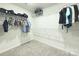 Spacious walk-in closet with carpet flooring and wire shelving to maximize storage at 240 Orson Oaks Ln, Pineville, NC 28134