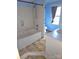 Bathroom with blue walls, shower and a bathtub at 29 Willow St # 31, Badin, NC 28009